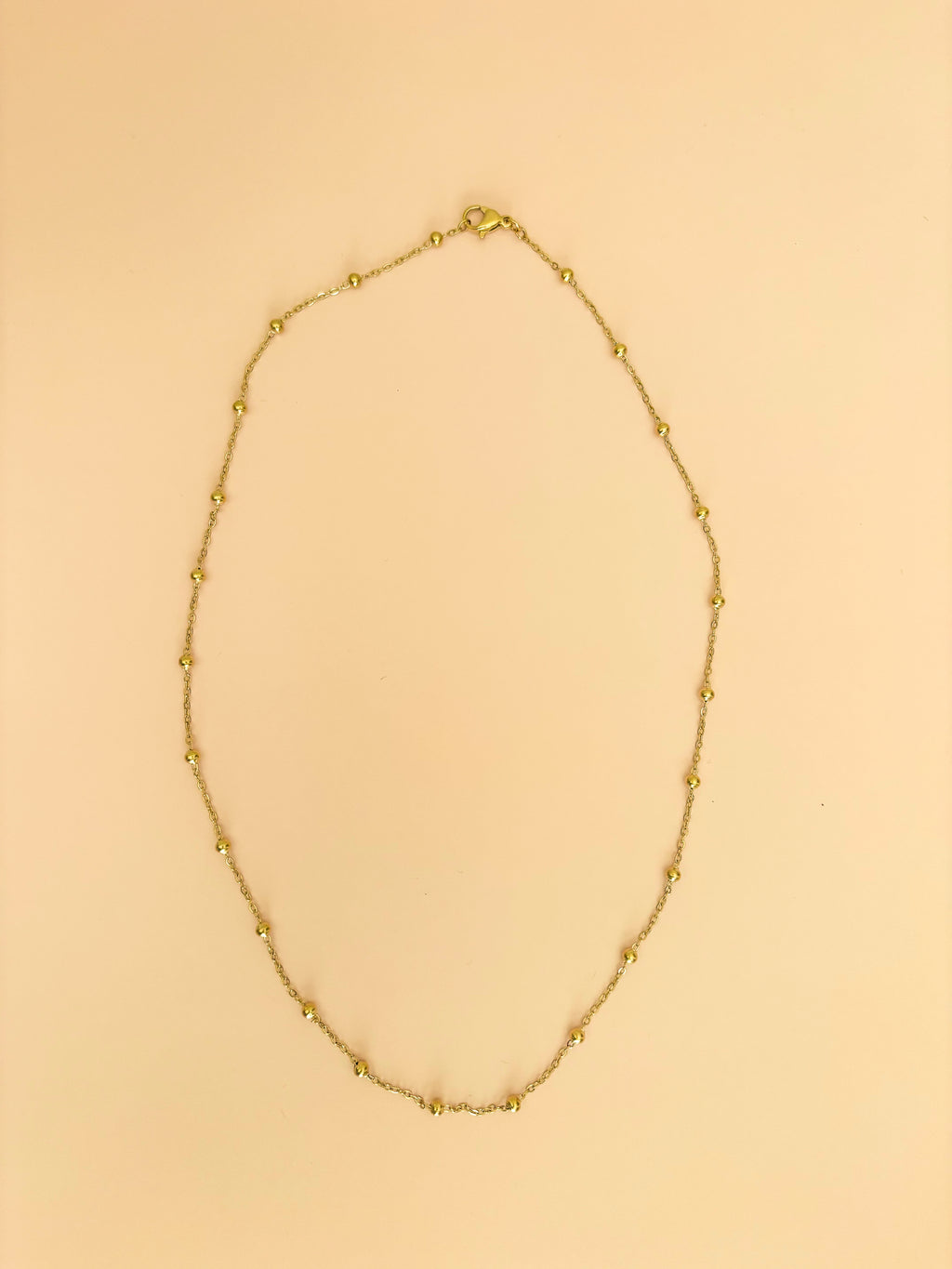 Layered gold chain necklaces by Hasten House in multiple lengths