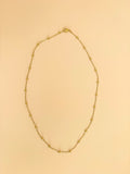 Layered gold chain necklaces by Hasten House in multiple lengths