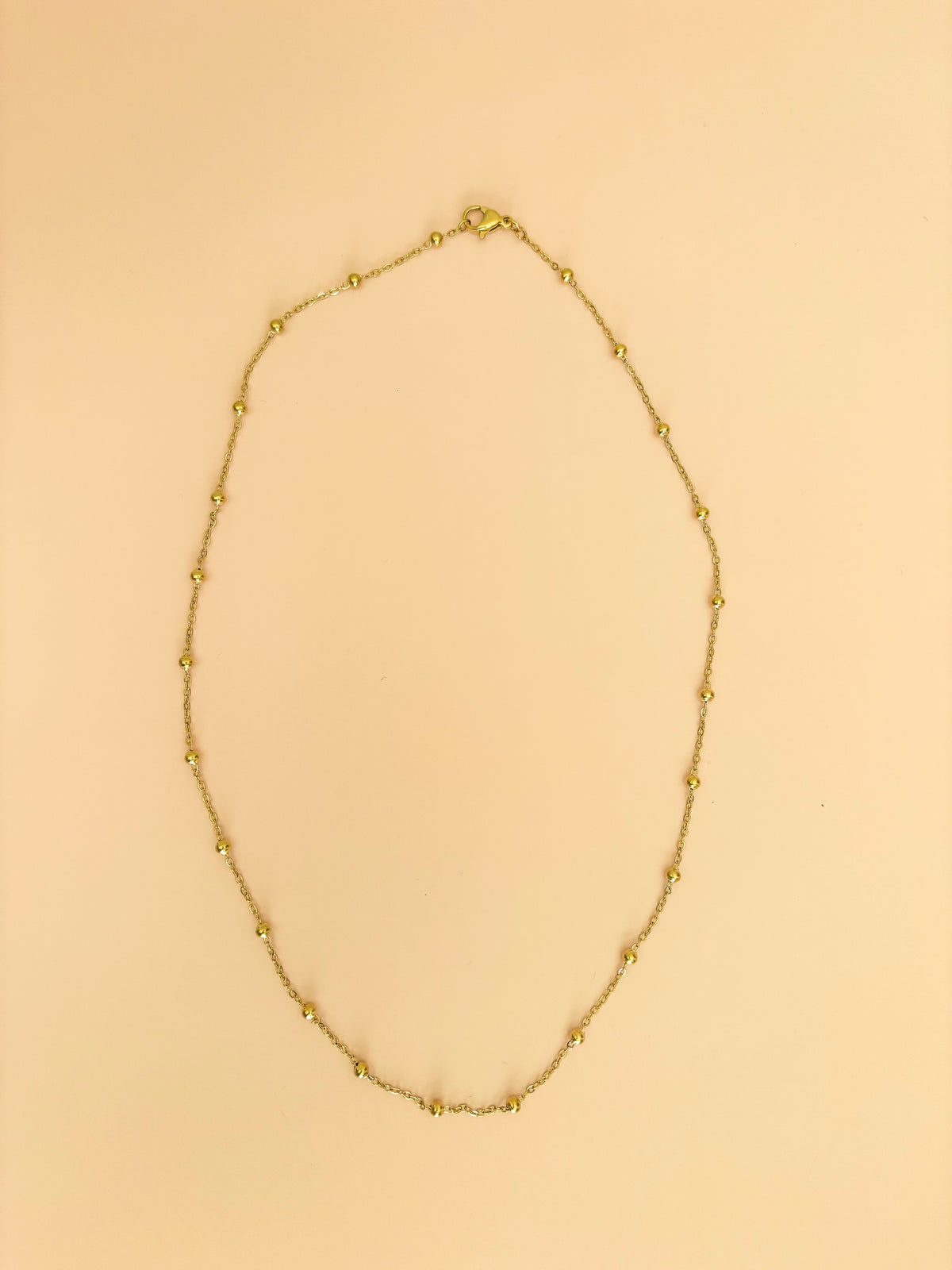 Layered gold chain necklaces by Hasten House in multiple lengths